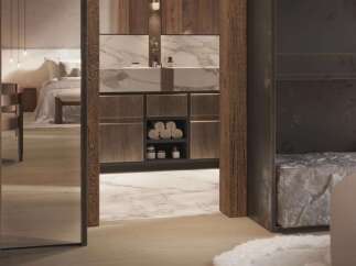 Luxury bathroom with marble vanity and wooden cabinetry, offering a serene and spa-like atmosphere.