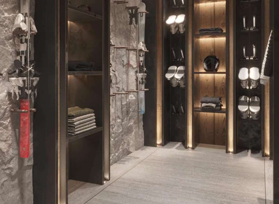 This luxurious ski room boasts custom built-in cabinetry, sleek modern design, and ample storage for all your winter gear.