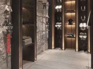 This luxurious ski room boasts custom built-in cabinetry, sleek modern design, and ample storage for all your winter gear.