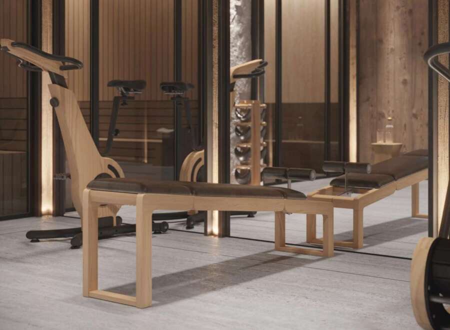 Luxury home gym with custom wooden equipment.