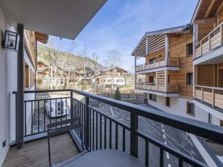 Enjoy breathtaking mountain views from this stunning balcony.