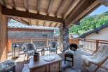 Enjoy breathtaking mountain views from this stunning chalet balcony.