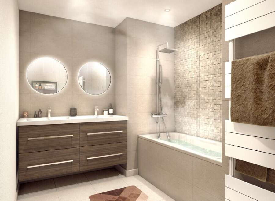 Discover a modern bathroom design featuring a sleek vanity with double sinks and stylish round mirrors.