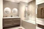 Discover a modern bathroom design featuring a sleek vanity with double sinks and stylish round mirrors.