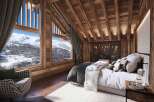 Experience the ultimate alpine retreat in this stunning bedroom.