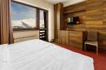 Enjoy breathtaking mountain views from this cozy hotel room.