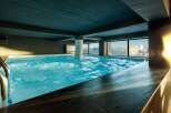 Indulge in the ultimate relaxation at this luxurious indoor pool, offering breathtaking mountain views.