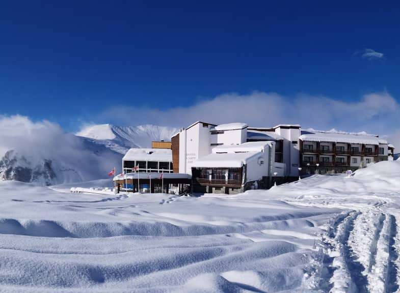 Experience the ultimate winter getaway at this stunning snow-covered resort.