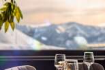 Enjoy breathtaking mountain views from this elegant dining setting.