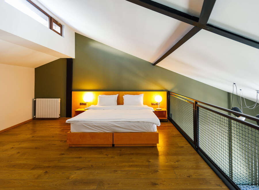 Discover a stylish loft bedroom with a modern design.