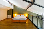 Discover a stylish loft bedroom with a modern design.