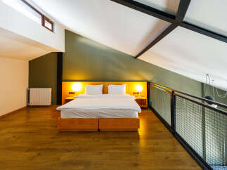 Discover a stylish loft bedroom with a modern design.