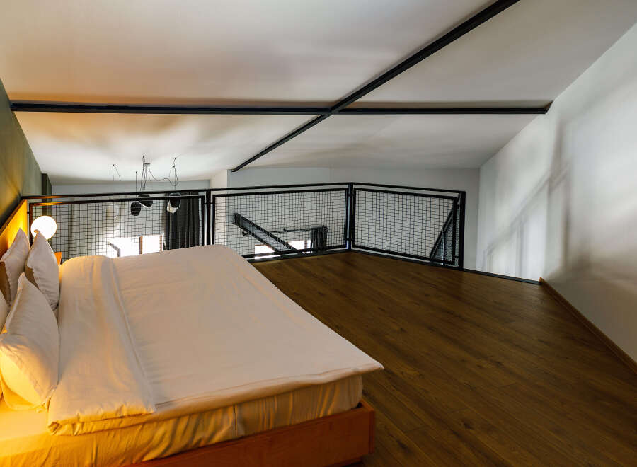 Experience modern luxury in this stylish loft bedroom.