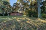 Nestled in a serene forest setting, this charming log cabin offers a tranquil escape.