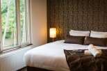 Wake up to stunning views from this cozy bedroom, featuring a comfortable double bed and luxurious linens.
