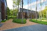 Discover serene forest living at this stunning property.