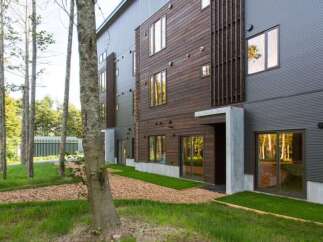 Discover modern living nestled in nature's embrace.
