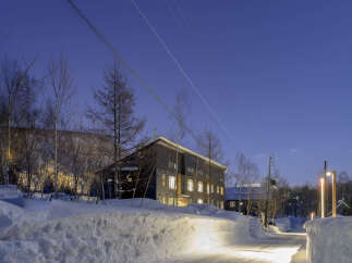 Luxury lodge nestled in a snowy landscape, offering breathtaking views and serene ambiance.