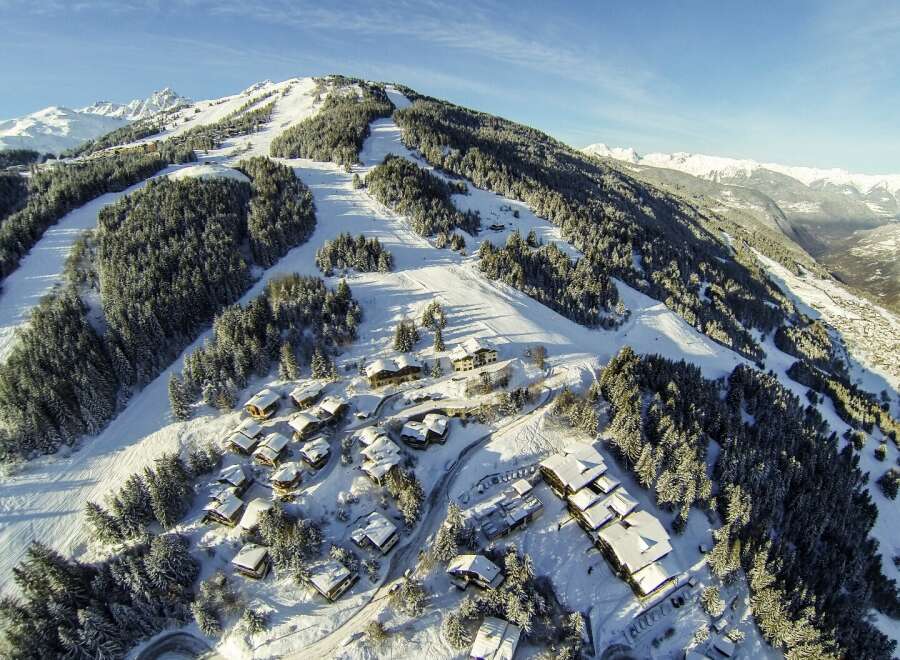 Nestled in a snowy mountainside, this charming chalet village offers breathtaking views and ski-in/ski-out access.
