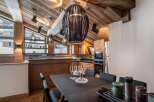 This stunning chalet boasts a spacious open-plan kitchen and dining area, perfect for entertaining guests.