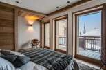 Luxurious chalet bedroom with stunning mountain views.