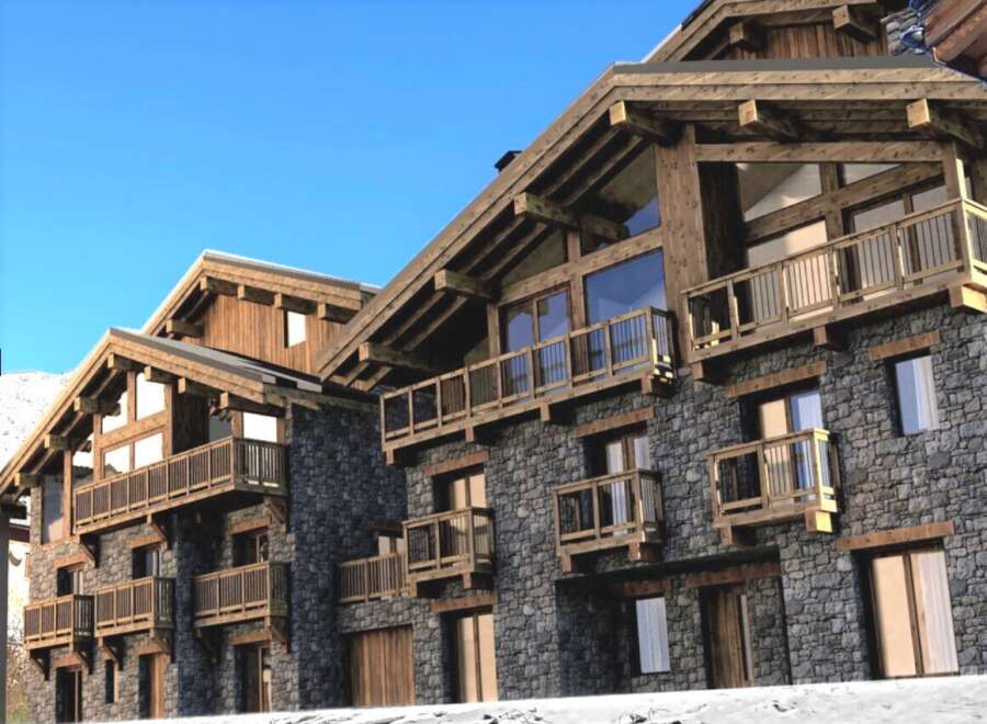 Luxury chalet apartments in the French Alps, boasting stunning mountain views and exquisite wooden architecture.