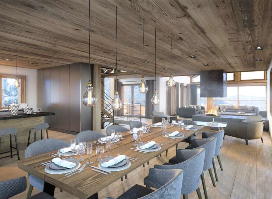 This stunning chalet boasts a spacious open-plan living area with a cozy fireplace, perfect for entertaining guests.