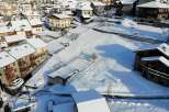 This stunning property boasts a prime location in a picturesque snow-covered village, offering breathtaking views of the surrounding mountains.