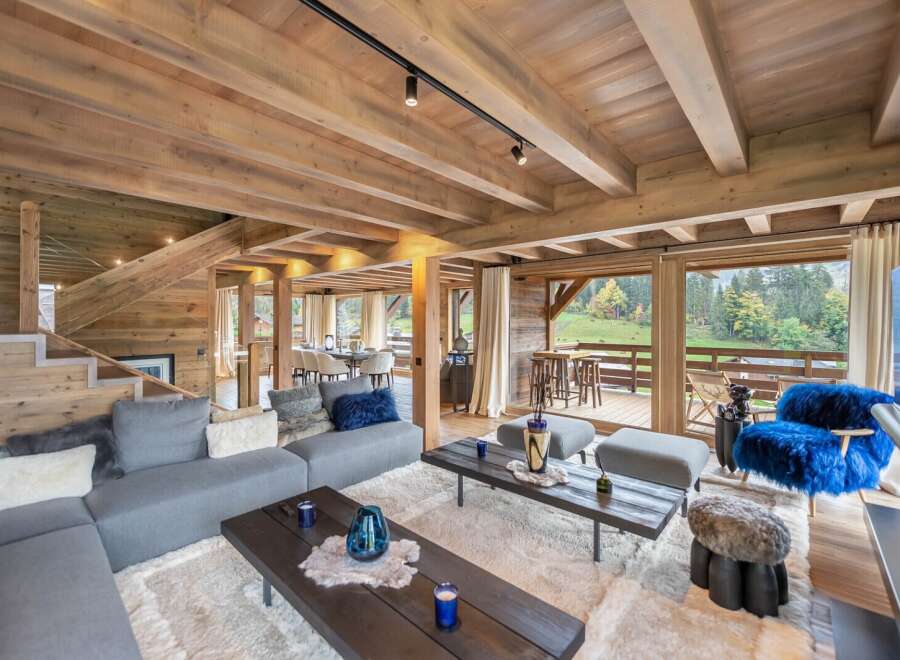Luxury chalet with stunning mountain views and spacious open-plan living area.