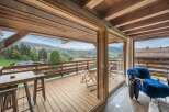 Luxury chalet with breathtaking mountain views and spacious deck.