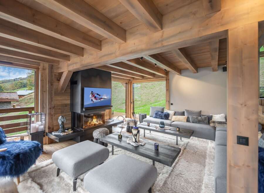 Luxury chalet with stunning mountain views and a cozy fireplace.