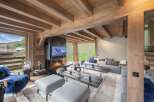 Luxury chalet with stunning mountain views and a cozy fireplace.