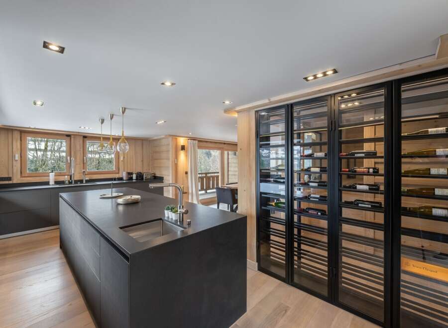 This stunning kitchen boasts a sleek, modern design with high-end finishes.