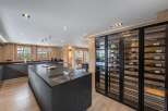 This stunning kitchen boasts a sleek, modern design with high-end finishes.