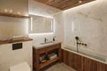 Luxury bathroom with marble walls and wooden accents.