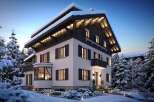 Luxury chalet in snowy mountain setting.