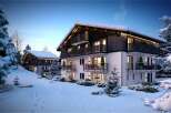 Luxury chalet apartments in a stunning snowy setting.