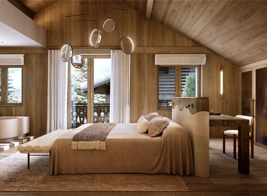 Luxurious chalet bedroom with stunning mountain views and a cozy atmosphere.