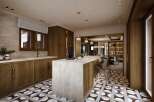 This stunning kitchen boasts a large island with a beige countertop, perfect for casual dining and meal preparation.