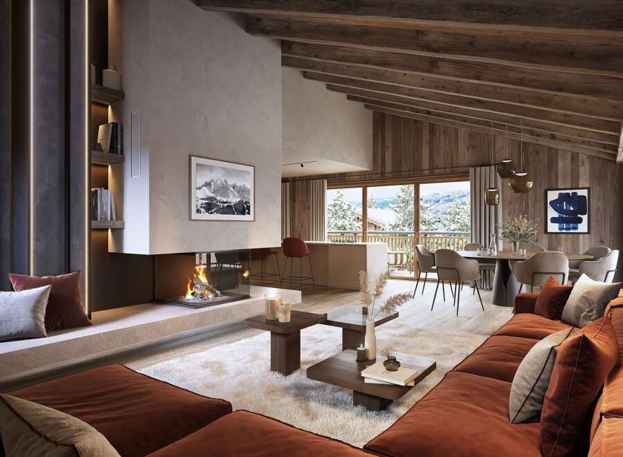 This stunning chalet boasts a spacious open-plan living area with a cozy fireplace, perfect for relaxing after a day on the slopes.