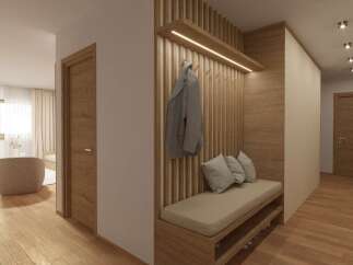 Step into a beautifully designed entryway with warm wooden accents and a welcoming bench.
