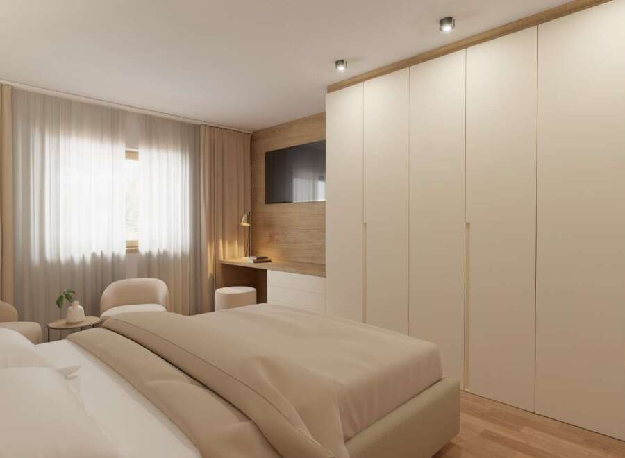 This bedroom boasts a modern design with a neutral color palette, creating a serene and inviting atmosphere.