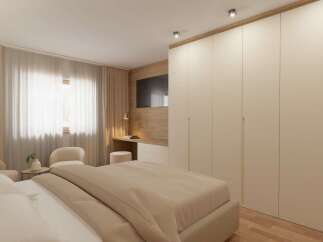 This bedroom boasts a modern design with a neutral color palette, creating a serene and inviting atmosphere.