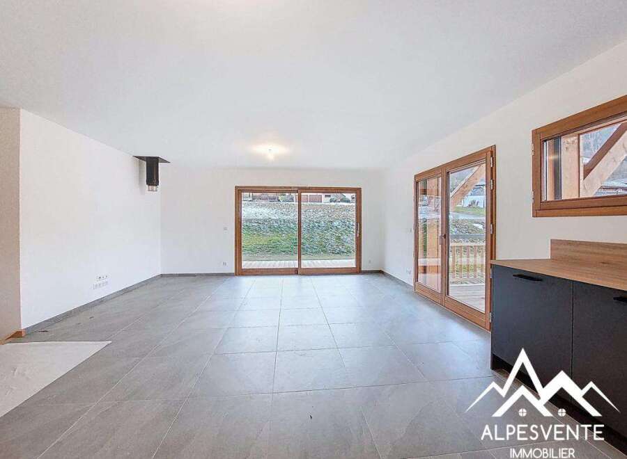 Discover this stunning property featuring a bright and spacious living area with large windows that offer beautiful views.