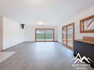 Discover this stunning property featuring a bright and spacious living area with large windows that offer beautiful views.