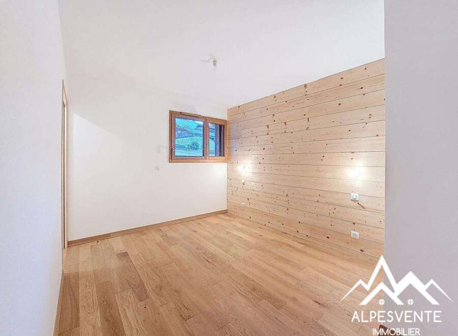 Discover this charming property featuring a warm wooden accent wall and beautiful hardwood floors.