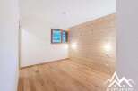 Discover this charming property featuring a warm wooden accent wall and beautiful hardwood floors.