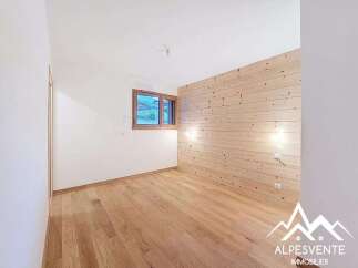 Discover this charming property featuring a warm wooden accent wall and beautiful hardwood floors.