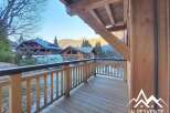 Enjoy breathtaking mountain views from this charming balcony.
