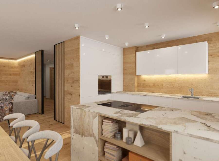 Experience modern living in this stunning property, featuring a beautifully designed kitchen with sleek white cabinetry and a unique marble island.